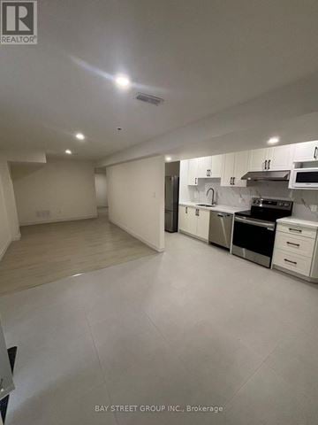 Markham (Greensborough) apartment for rent - A spacious kitchen with white cabinets and appliances.