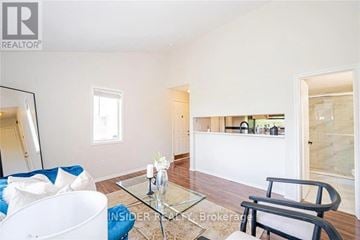 Mississauga (Hurontario) townhouse for rent - A living room with a glass table and a white sofa.