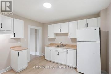 Belleville (Belleville Ward) apartment for rent - A kitchen with white cabinets and appliances.