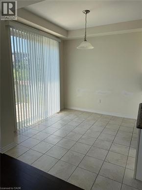 Cambridge apartment for rent - A room with a sliding glass door and a light fixture.