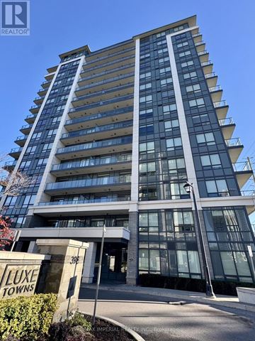 Richmond Hill (Doncrest) condo for rent - A tall building with the sign "LUXE TOWNS" in front of it.