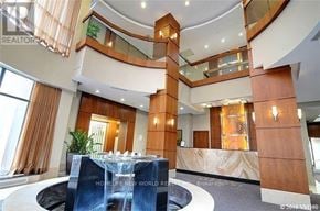 Toronto (Willowdale East) condo for rent - A large, modern interior space with a water feature in the center.