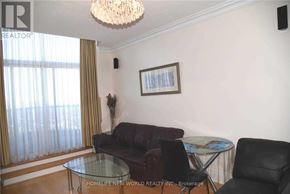 Toronto (Willowdale East) condo for rent - A living room with a glass table and a sofa.