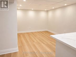 Toronto (Woburn) apartment for rent - A room with EXP REALTY, Brokerage logo on the wall.