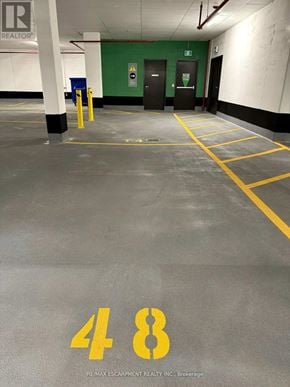 Milton (Fo Ford) condo for rent - A parking garage with the number 48 painted on the floor.