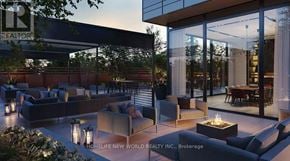 Toronto (Cabbagetown-South St. James Town) condo for rent - A modern outdoor seating area with a fire pit in the center.
