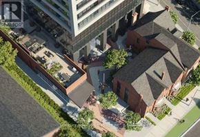 Toronto (Cabbagetown-South St. James Town) condo for rent - A bird's eye view of a city street with a mix of modern and traditional buildings.