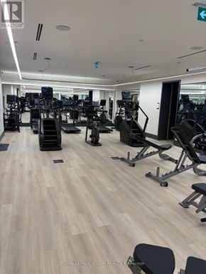 Toronto (Englemount-Lawrence) condo for rent - A gym with a variety of equipment including treadmills, weights, and exercise machines.