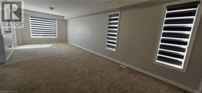 Ayr apartment for rent - A room with carpeted floor and two windows with blinds.