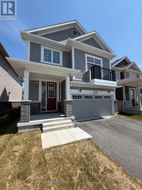 Loyalist (Bath) apartment for rent - A modern two-story house with a garage and a balcony.