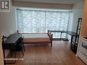 Toronto (Bendale) condo for rent - A kitchen area with a table and chairs is shown in the image.