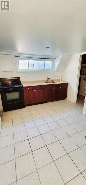 Mississauga (East Credit) apartment for rent - A kitchen with white tiled floors and wooden cabinets.