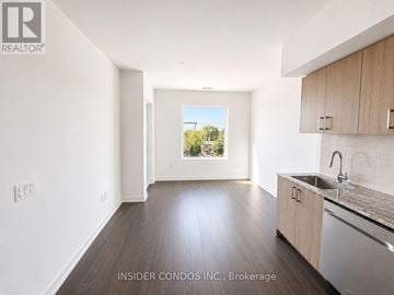 Toronto (Humber Heights) condo for rent - A kitchen with a sink and a window showing a tree.