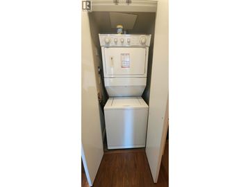 Vancouver apartment for rent - A white oven and microwave are installed in a small kitchen.