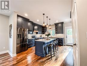Fort Erie (Crystal Beach) apartment for rent - A modern kitchen with dark wood cabinets and stainless steel appliances.