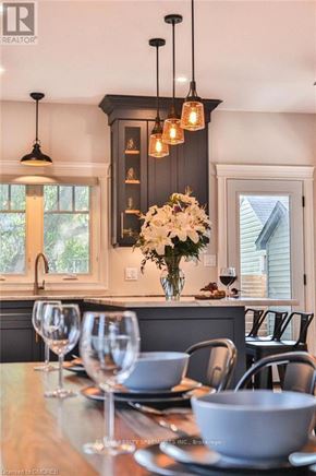 Fort Erie (Crystal Beach) apartment for rent - A dining table set with wine glasses and plates.