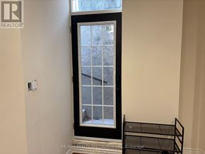 Oakville (Ga Glen Abbey) apartment for rent - A window with a black frame in a room with white walls.