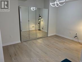 Oakville (Ga Glen Abbey) apartment for rent - A room with a glass door and a light on the wall.