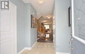 Milton (De Dempsey) townhouse for rent - A hallway with a door on the left and a door on the right.
