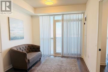 Vaughan (Vaughan Corporate Centre) condo for rent - A living room with a brown couch and a painting on the wall.