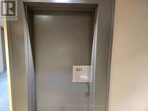 Burlington (Tansley) condo for rent - A metal door with a sign that says 401 on it.