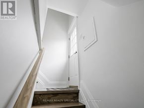 Toronto (Humber Heights) apartment for rent - A white hallway with a staircase leading to the second floor.
