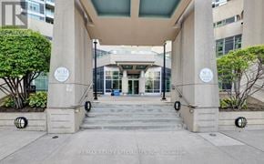 Mississauga (City Centre) condo for rent - A building entrance with a glass door and a sign that reads N. 33.