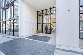Hamilton (Central) condo for rent - The entrance to a building with a glass door and a sign that reads "PLATINUM".