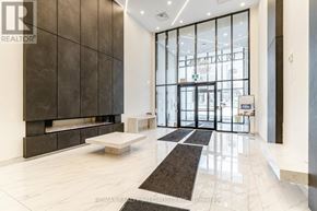 Hamilton (Central) condo for rent - A lobby with a bench and a large window.