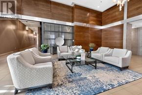 Mississauga (Port Credit) condo for rent - A living room with a sofa, armchair, and coffee table.