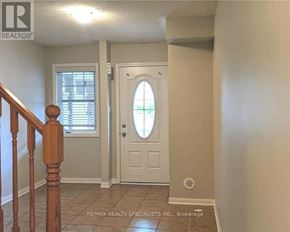 Milton (Ha Harrison) townhouse for rent - A hallway with a white door and a window with blinds.