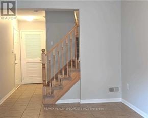 Milton (Ha Harrison) townhouse for rent - A hallway with a staircase and a door.