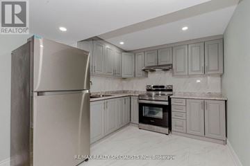 Brampton (Northwest Brampton) apartment for rent - A kitchen with a stainless steel refrigerator and oven.