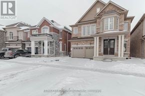 Brampton (Northwest Brampton) apartment for rent - A house with a car parked in front of it.