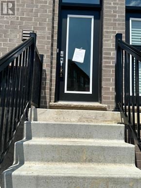 Brantford townhouse for rent - A black door with a sign on it.