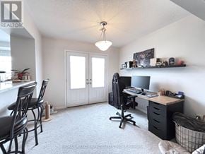 Milton (Ha Harrison) townhouse for rent - A room with a desk, chairs, and a window.