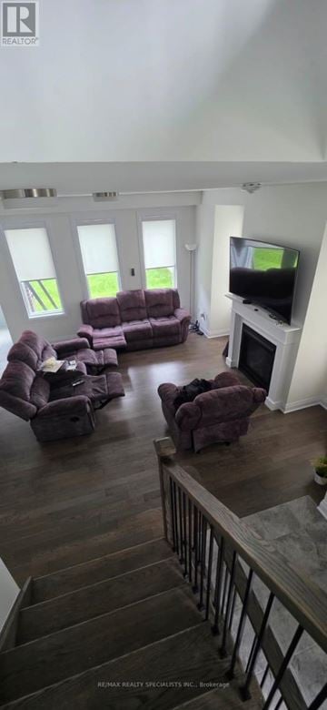 Brampton (Northwest Brampton) apartment for rent - A living room with a purple couch and a television.