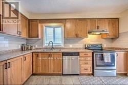London South (South U) apartment for rent - A kitchen with wooden cabinets and a stainless steel dishwasher.