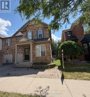 Milton (Be Beaty) apartment for rent - A house with a sign that says REALTOR in front of it.