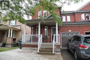 Mississauga (Churchill Meadows) apartment for rent - A house with a car parked in front.