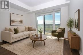 Mississauga (Central Erin Mills) condo for rent - A living room with a couch, chair, and coffee table.