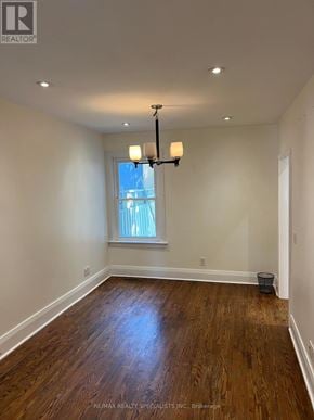 Toronto (Humewood-Cedarvale) apartment for rent - A room with wooden floors and a window with blinds.
