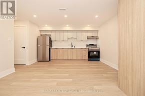 Mississauga (Lakeview) apartment for rent - A kitchen with wooden floors and white walls.