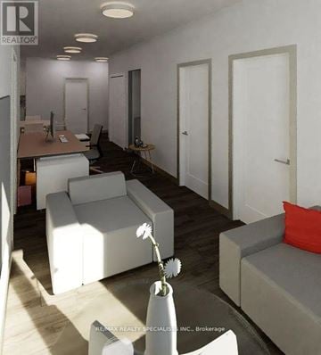 Hamilton (Beasley) condo for rent - A living room with white furniture and a vase of flowers on a table.