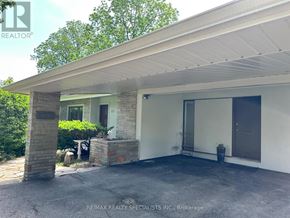 Vaughan (Islington Woods) apartment for rent - A house with a white garage door and a brick pillar in front of it.