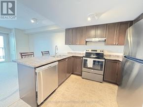 Guelph (Pineridge/Westminster Woods) condo for rent - A kitchen with a stainless steel refrigerator, dishwasher, and oven.