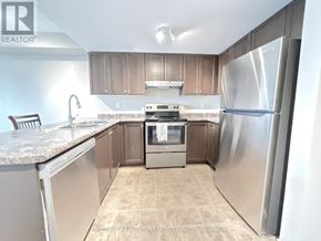 Guelph (Pineridge/Westminster Woods) condo for rent - A kitchen with a refrigerator, oven, and microwave.