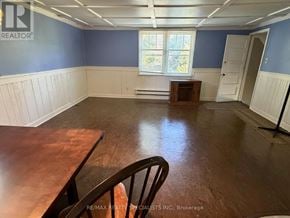 Mississauga (Clarkson) apartment for rent - A room with blue walls and a wooden table.