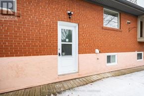 Burlington (Brant) apartment for rent - A red brick house with a white door and windows.