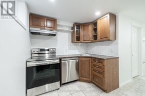 Burlington (Brant) apartment for rent - A kitchen with wooden cabinets and stainless steel appliances.
